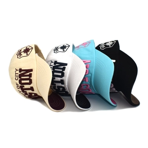 Close-up of four colorful baseball caps with Boston embroidery and SINUGA patches
