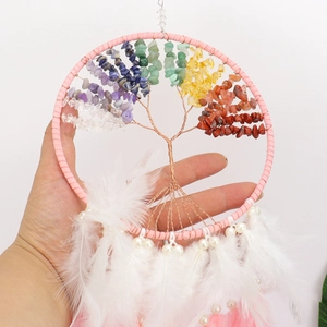 Handmade tree of life dream catcher with colorful crystal stones and soft feathers