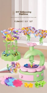 Close-up of DIY flower press machine kit with colorful fabric petals and butterfly parts