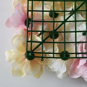 Pink and beige faux rose wall panel featuring a durable green plastic mesh backing