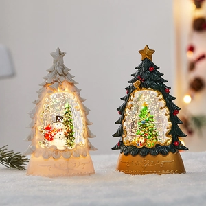 Luminous Christmas tree snow globe lanterns in white and dark green with snowman scene