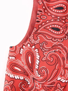 Detailed close-up of the red paisley vest fabric showing fine sewing and print quality