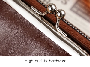 Detail of silver kiss-lock closure on dark brown vintage leather coin purse hardware