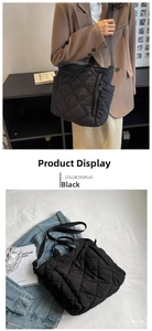 Close-up of black quilted tote bag with diamond stitching and adjustable shoulder strap