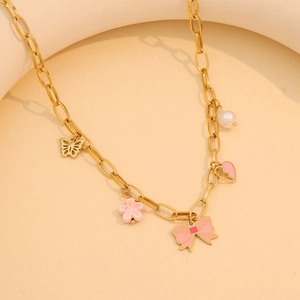 Golden necklace with pink enamel flower, butterfly bow, and pearl charm pendants