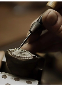 Detail of ancient method hand-carved 999 sterling silver earring with matte texture