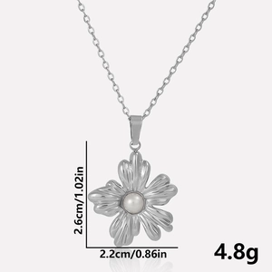 Detailed view of 304 stainless steel flower pendant necklace with white pearl center