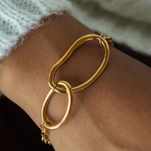 Minimalist 18K gold plated stainless steel bracelet with OT toggle clasp on a wrist