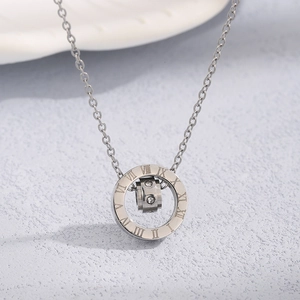 Macro detail of silver titanium steel necklace with Roman numerals and zircon stones