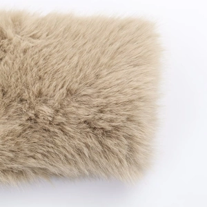 Macro shot showing soft texture of light brown faux fur on this short fashion jacket