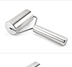 Close-up of a stainless steel roller rolling pin with a smooth metal handle for baking