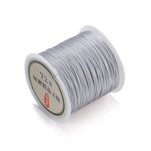 Detail view of 0.8mm silver grey braided cord for handmade jewelry and knotting
