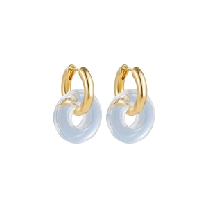 Detail of minimalist gold hoop earrings featuring high-clarity transparent resin charms
