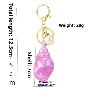 Detailed view of colorful conch keychain with pearl and dimensions showing 12.5cm total length