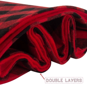 Detail view of double layer red and black buffalo plaid fabric for Christmas tree skirt