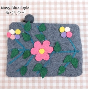 Detail of navy blue wool felt coin purse with floral embroidery and size 14x20.5cm