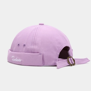 Detail of lavender docker hat featuring white Forever embroidery and adjustable metal buckle