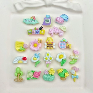 Mini resin spring-themed DIY charms including flowers and bees for nail art and jewelry