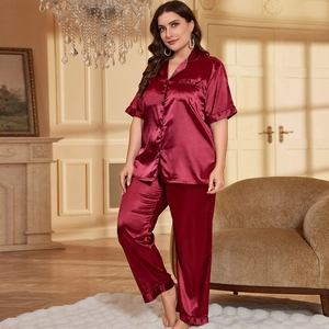 Women's two-piece ice silk pajama set in deep burgundy satin with black piping trim