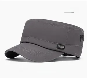Detail of dark gray flat top cap featuring leather side patch and embroidered W logo