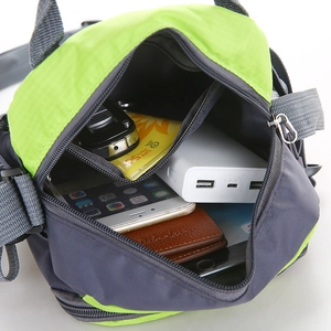 Versatile neon green sports crossbody bag with multi-layer storage shown from top view