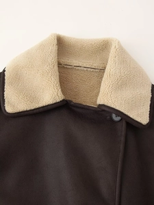 Detailed close-up of dark brown faux suede jacket with beige faux shearling collar
