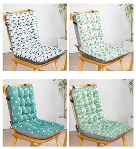 Detail of four printed chair cushions featuring whale and flamingo patterns with ties