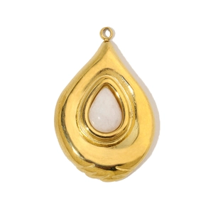 Detailed view of water drop gold stainless steel pendant with white stone inlay