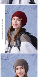 Close-up of knit winter beanie with diamond pattern texture and side leather logo tag