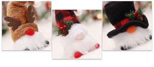 Detail of Christmas gnomes with LED lights, pine cones and berries for tree decoration