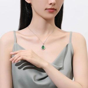 S925 sterling silver necklace with a green pear-shaped pendant and shimmering diamonds