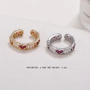 Detail of adjustable open heart rings in gold and silver with cubic zirconia inlay