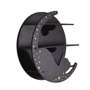 Detail of black crescent moon cat shelf with golden stars and wooden storage tiers
