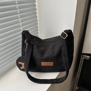 Large capacity black corduroy shoulder tote bag with a small coin purse and gold hardware