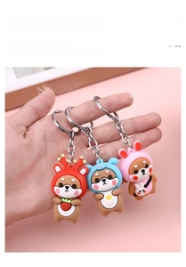 Detailed view of three cute silicone shiba inu and bear keychains with metal rings
