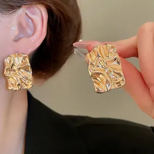 Elegant gold pleated rectangular stud earrings with textured metallic finish for women