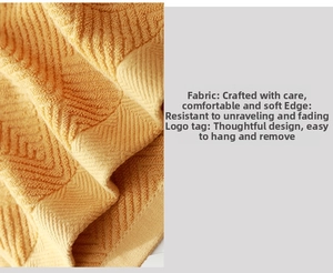 Detail of yellow cotton towel showing diamond weave texture and reinforced edges