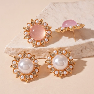 Vintage sunflower stud earrings with pink resin crystals and white pearls in gold setting