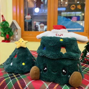 Detail of plush Christmas tree doll and star ornament on a festive red and green plaid cloth