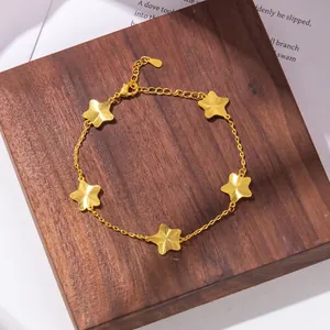 Elegant gold star charm bracelet featuring five brushed finish pendants and adjustable chain