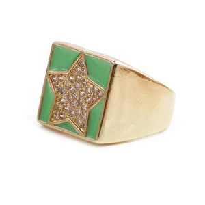 Detail of gold star ring featuring green enamel and pavé-set crystals with an open band