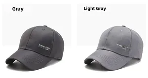 Detail view of grey and light grey baseball caps with 3D Sport Cap logo and curved brim