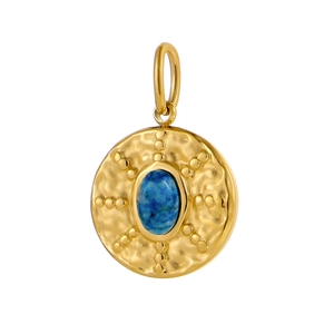 Close-up of vintage golden round pendant with blue oval gemstone and textured ripples