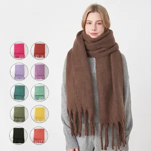 Thick mohair winter scarf with tassels for women shown in multiple colors