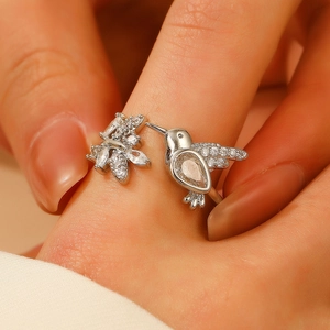 Silver hummingbird open ring with zircon crystals and floral branch design for women