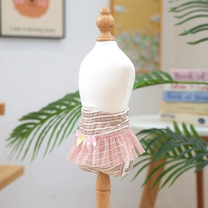 Detailed view of pink lace pet physiological pants on a white dog mannequin model