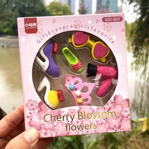 Pink fashion accessory shaped erasers in window gift box with high heel and crown designs