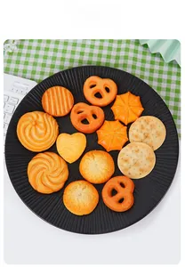 Realistic large PVC cookie food models on black plate with aesthetic picnic background