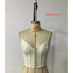 Detail of white textured jacquard bustier top with metal hook-and-eye front closure