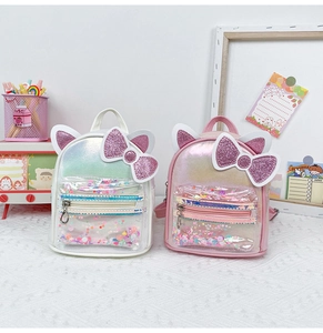 Detail of cute cat ear backpacks with holographic finish and sequin glitter pockets